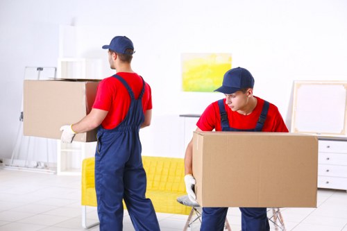 Furniture pick-up team working outside an Islington residential building