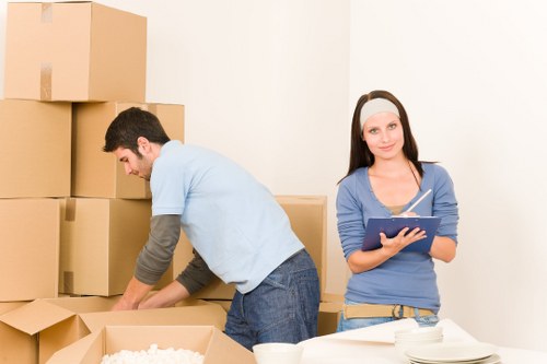 Packed boxes and furniture ready for removal in a London home
