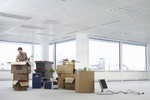 Preparing boxes and furniture for a moving truck in Islington