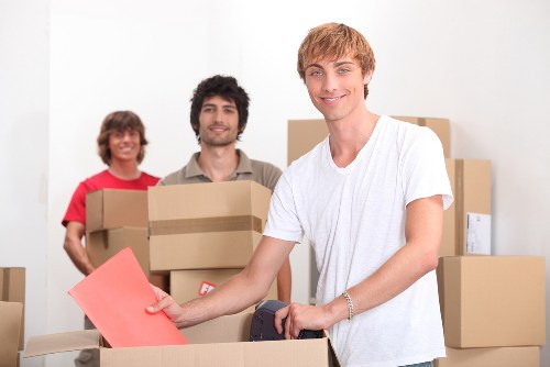 Local moving team transporting boxes and furniture across Islington