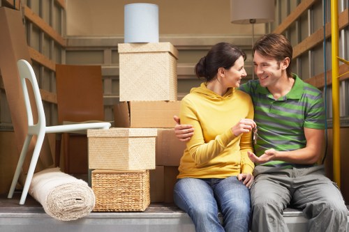 Two movers loading furniture for a small move in Islington